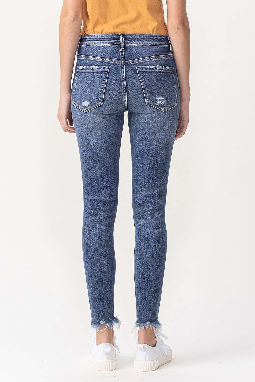 LOLA MID RISE ANKLE SKINNY JEANS WITH FRAYED HEM DETAIL